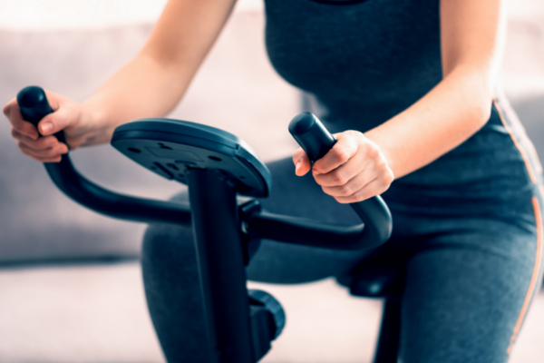 closeup woman on stationary bike
